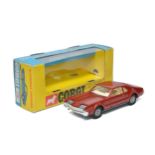 Corgi No. 276 Oldsmobile Toronado. Metallic burgundy with white interior. Cast hubs. Displays very