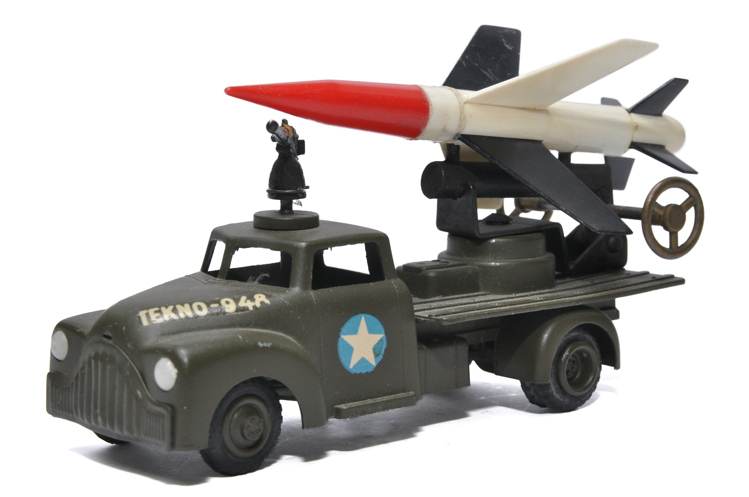 Tekno early issue Rocket Launcher with trio of rockets on back, missing roof gun. Displays good to