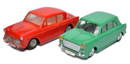 Telsalda duo of plastic friction driven British classic cars. Display good with minor signs of wear.