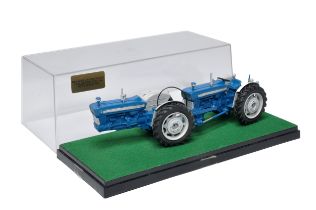 A well adapted Britains Farm 1/32 Model of a Doe 130 Tractor with custom wheels and parts as