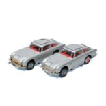 Corgi duo of James Bond 007 Aston Martin DB5's. One is excellent, the other good (mechanism requires