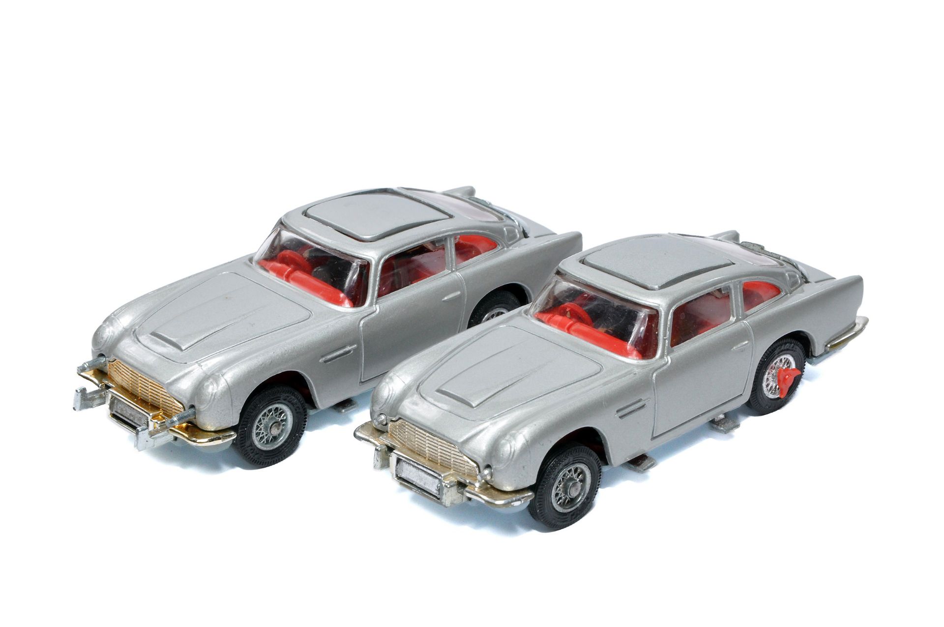 Corgi duo of James Bond 007 Aston Martin DB5's. One is excellent, the other good (mechanism requires