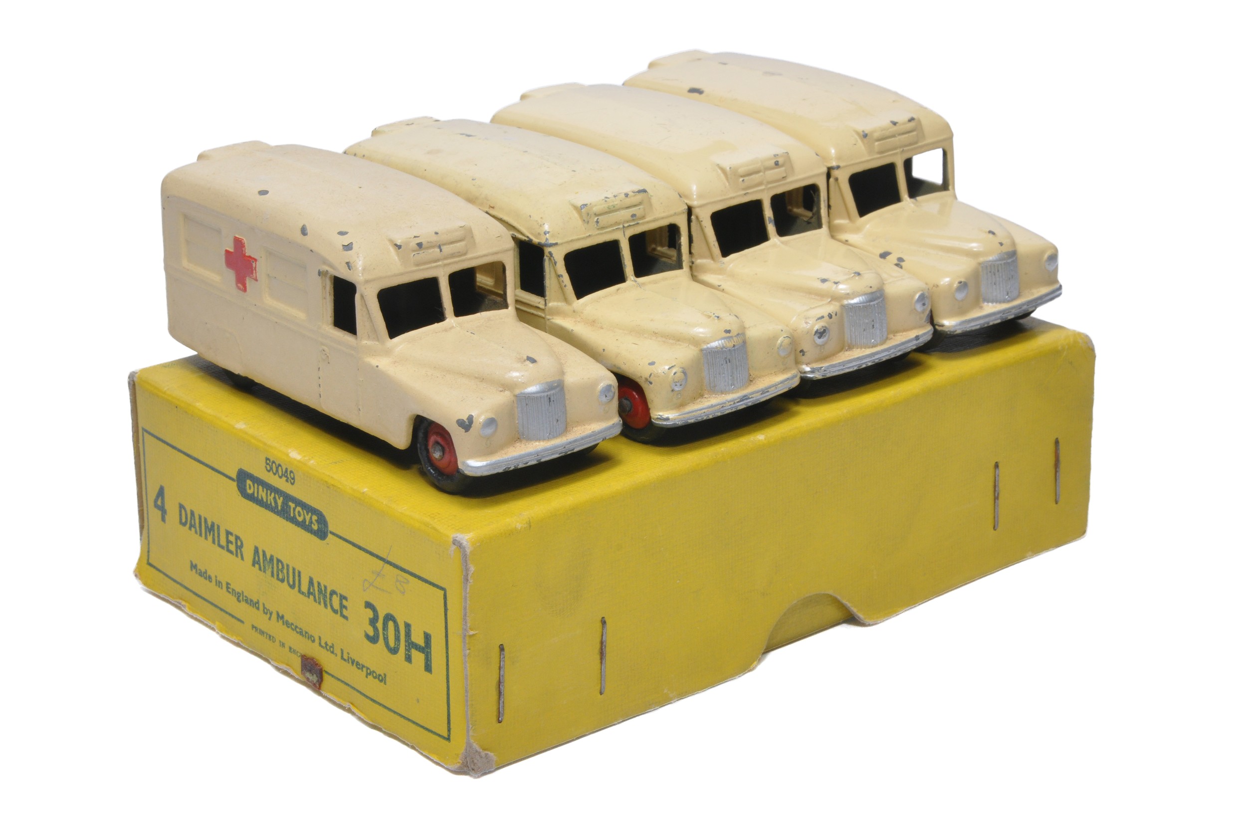 Dinky No. 30h Trade Pack Daimler "Ambulance" containing 4 examples. Display Fair in generally Good