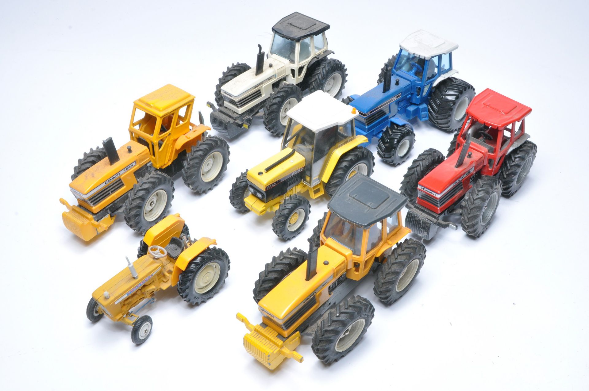 An assortment of mostly County themed tractor issues from mainly Britains plus other conversions.