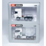 WSI 1/50 diecast model truck issue comprising duo of blank canvas trucks as shown (one has been