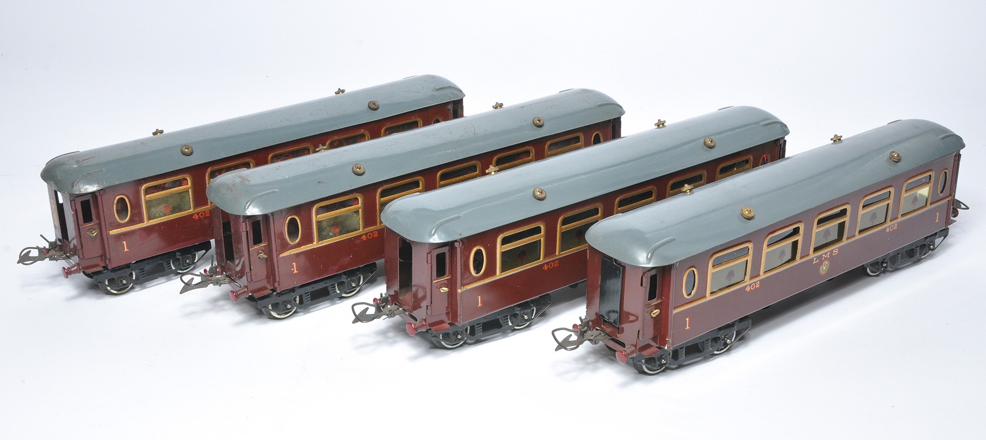 Hornby O Gauge Model Railway comprising four LMS Coaches as shown. Generally display good to very