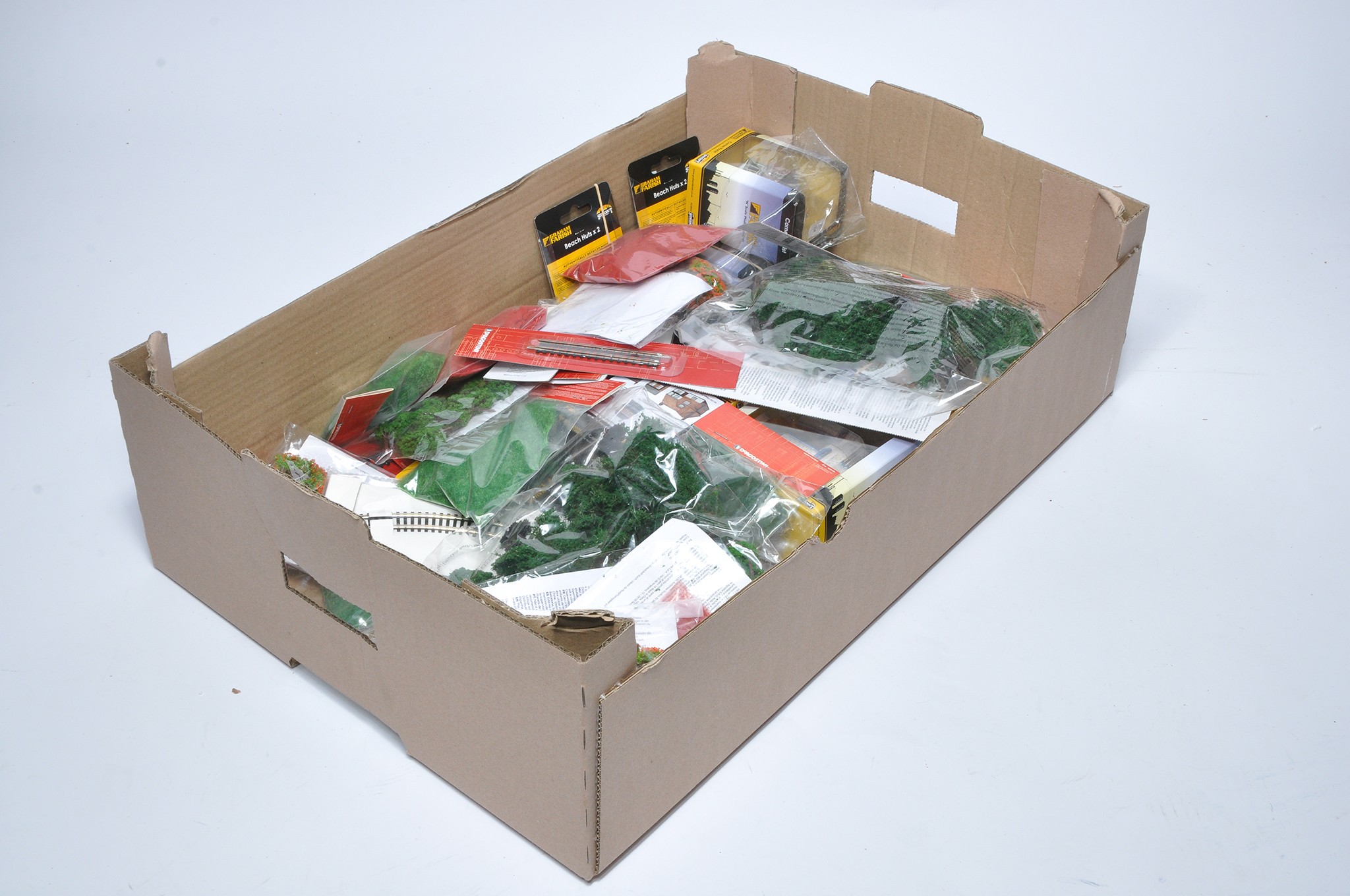 A quantity of unused model railway accessory items including mostly scenic pieces, as shown.