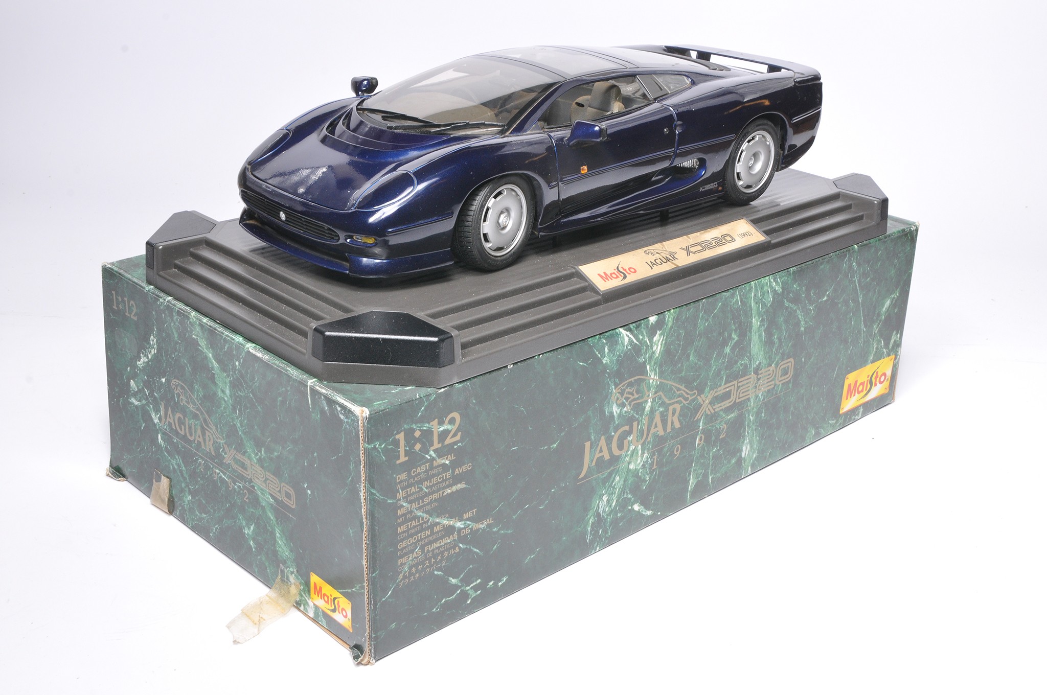 Maisto 1/12 diecast model issue comprising Jaguar XJ220 (Navy Blue). Displays good, some surface