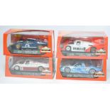 A group of four Slot.it slot car issues comprising Nissan R390 GT1, Porsche 956 KH, Ford MkII Le