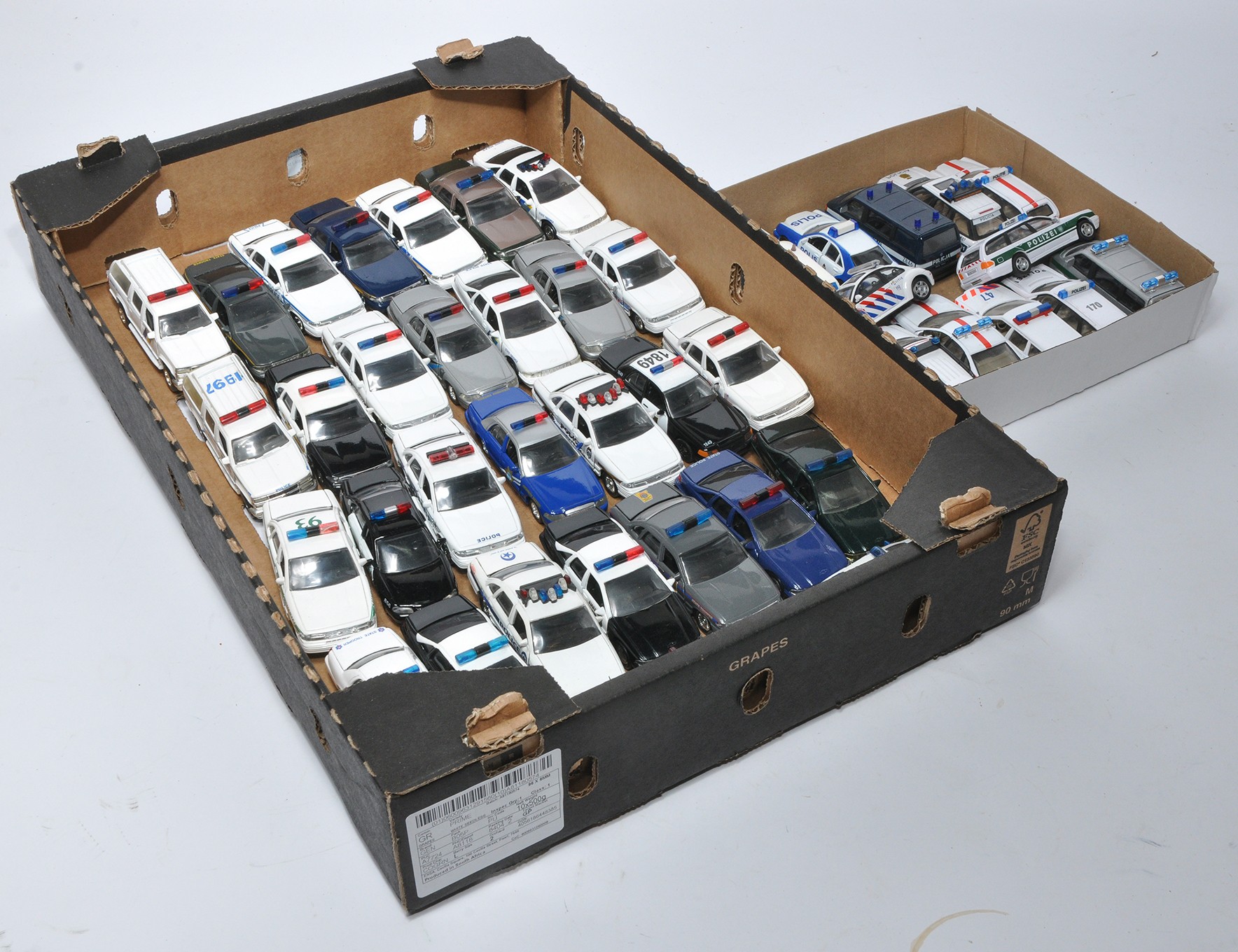 A tray of American Diecast Police Vehicles in various state liveries in addition to European