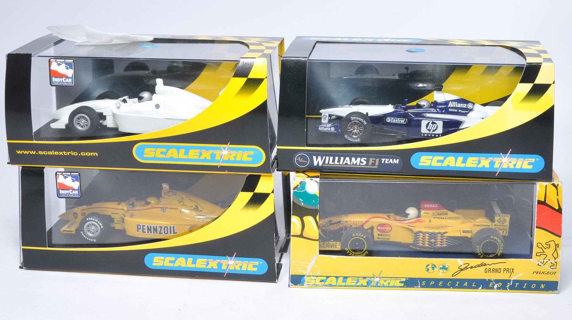 Scalextric slot car issues comprising Indy Car plain white, Dallara Indy 'Pennzoil,' Special Edition