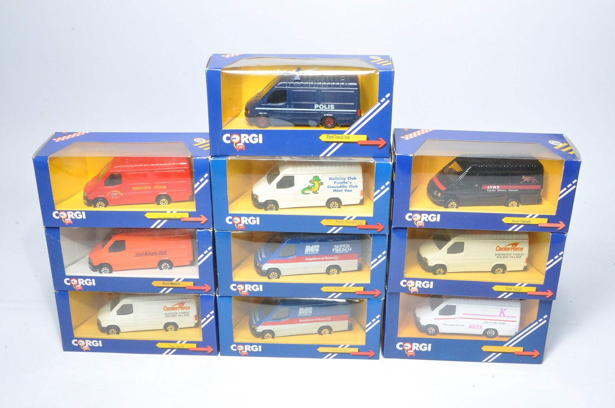 A group of ten diecast model vehicles from Corgi comprising 1980/90's issue Ford Transit Vans in