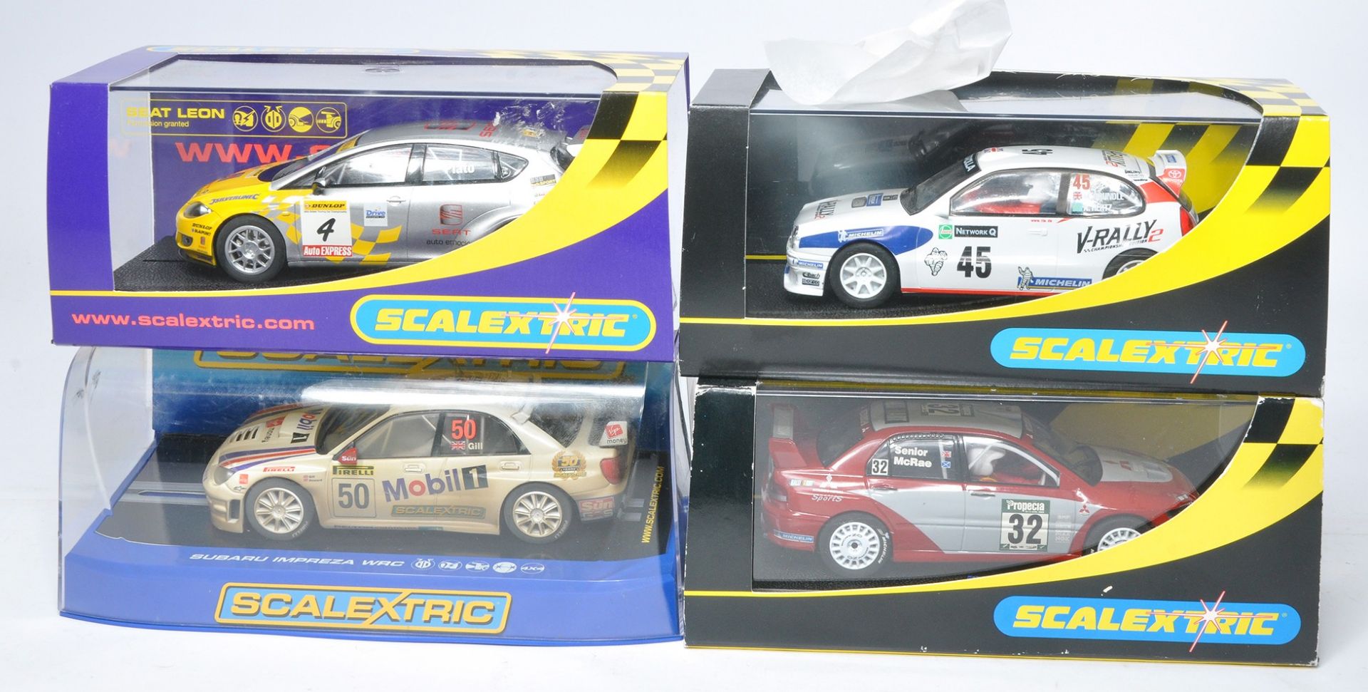 Scalextric slot car issues comprising Subaru Impreza WRC, Seat Leon BTCC, Mitsubishi Lancer plus