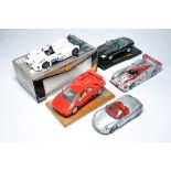 A group of 1/18 diecast model racing cars from Maisto, mostly. One is boxed.
