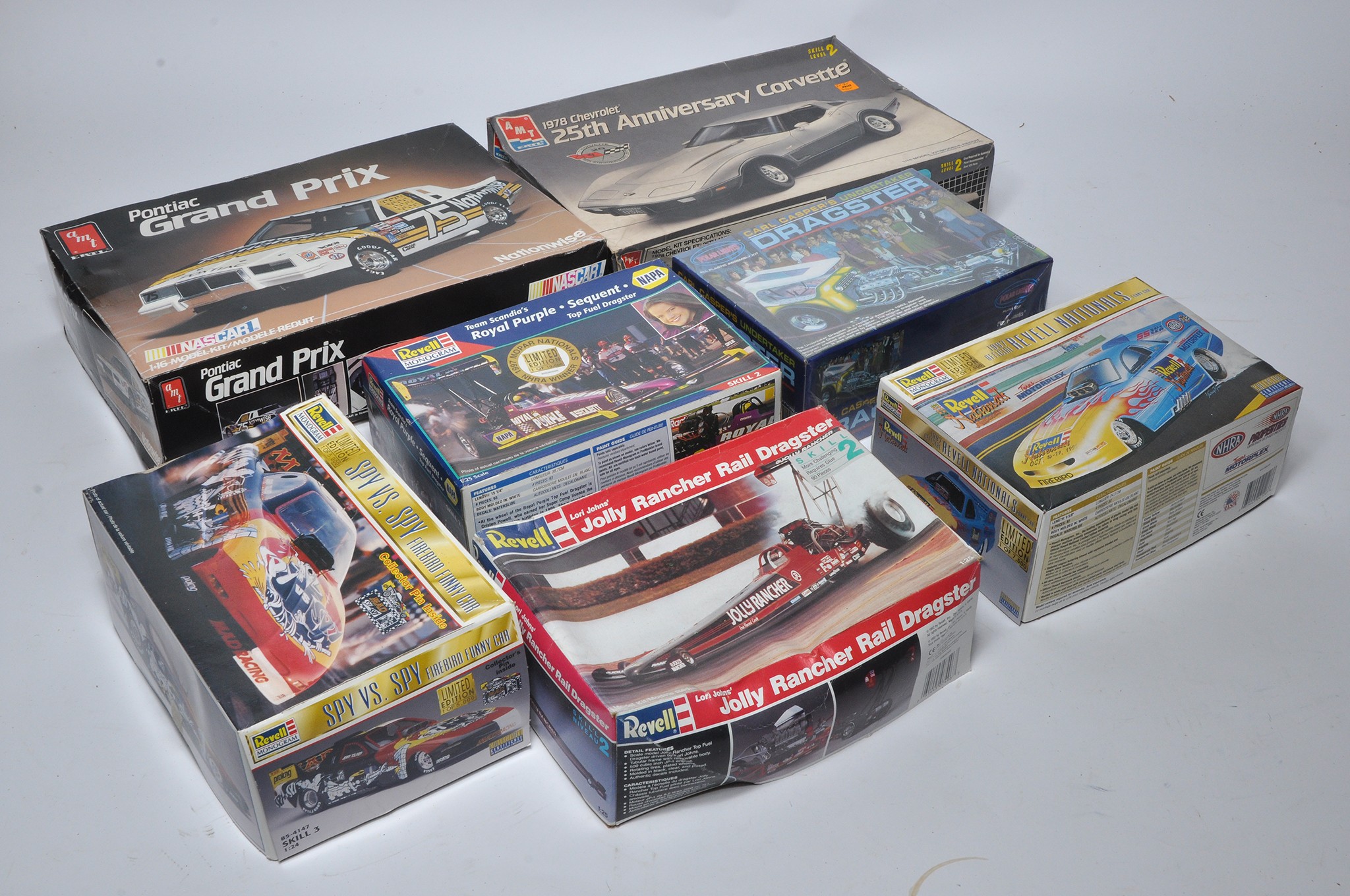 A group of 7 Plastic Model Kits comprising AMT 1/16 6746 Pontiac Grand Prix Nascar, Polar Lights