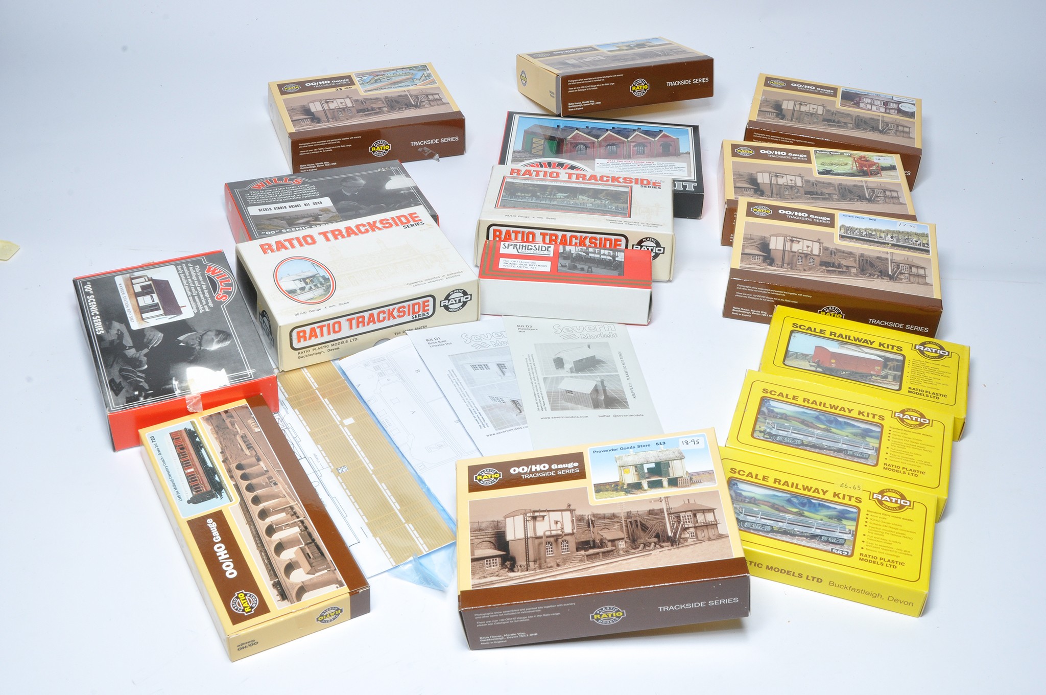 A large quantity of model railway kits relating to rolling stock and buildings / accessory items for