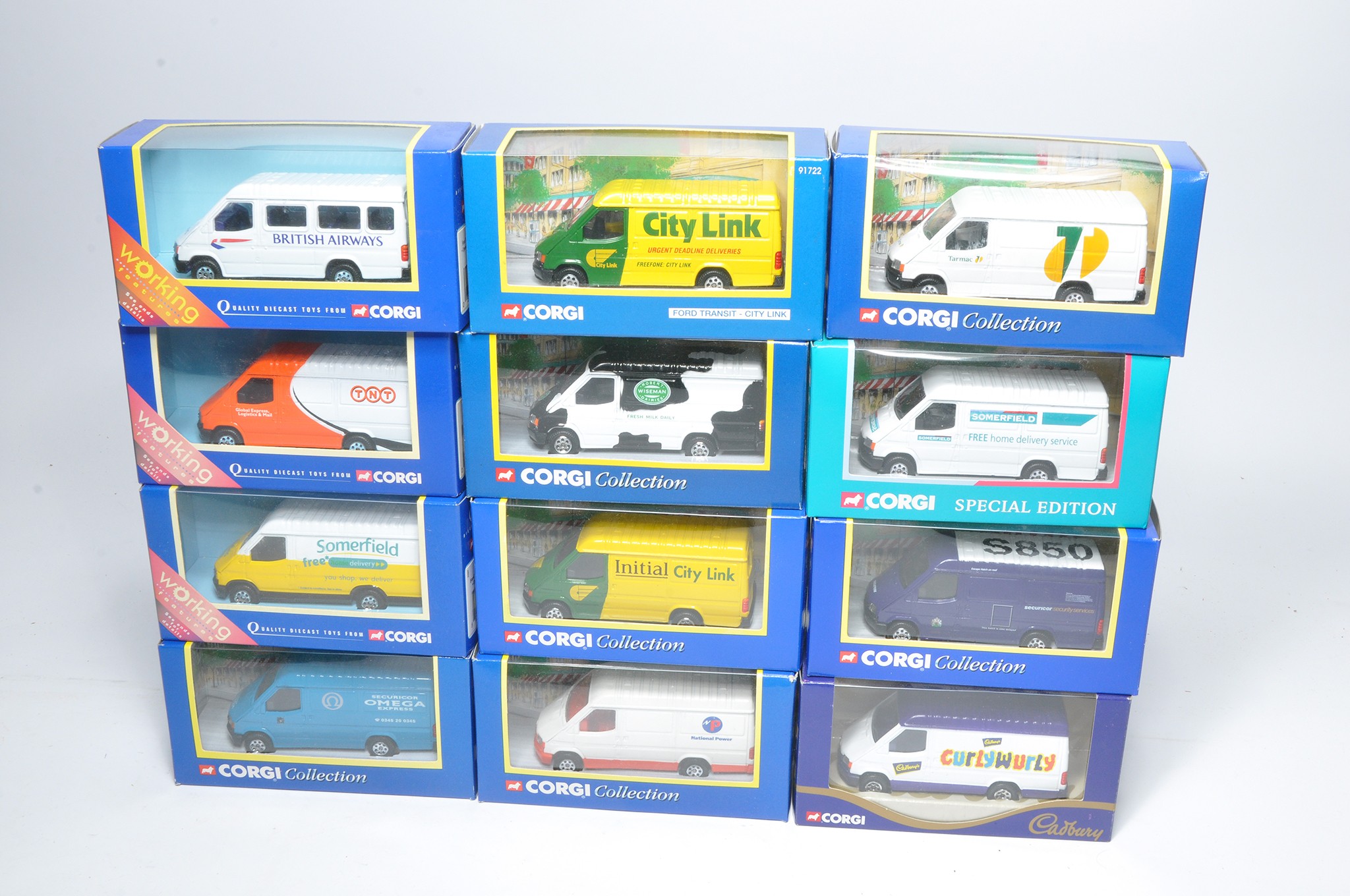 A group of twelve diecast model vehicles from Corgi comprising modern issue Ford Transit Vans in