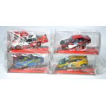 A group of four SCX slot car issues comprising Ford Escort MKII 'McRae' Dirt Effect, Nascar Dodge