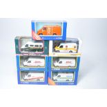 A group of seven diecast model vehicles from Corgi comprising modern issue Ford Transit Vans in