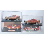 A group of four slot car issues comprising Fly BMW M3 E30, Team Slot Fiat 124 Abarth, Team Slot