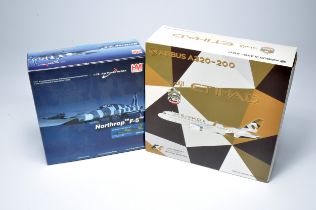Duo of diecast model aircraft including Etihad Airbus A320 and HM Northrop F5. Displayed.
