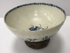 An 18th Century Worcester blue and white and relief decorated floral spray painted bowl,