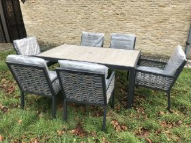 A Bramblecrest garden furniture set comprising "Seville" rectangular dining table and six