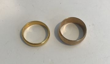 A 22 carat gold wedding band, size N, 4.1 g and a 9 carat gold wedding band, size N/O, 4.