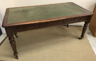 A mahogany library table in the Victorian manner,