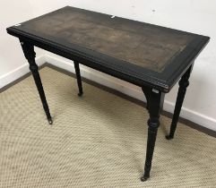 A 19th Century ebonised fold over card table by Lamb of Manchester,