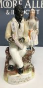 A Staffordshire ware figure "Uncle Tom and Eva",