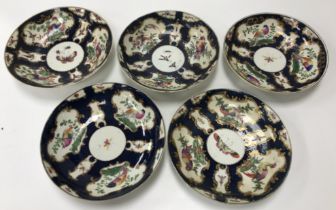 A collection of five 18th Century first period Worcester blue ground dishes decorated with panels