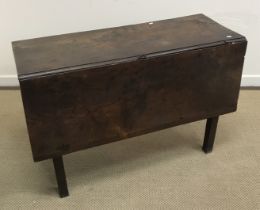 A 19th Century elm drop leaf dining table on square supports 118 cm x 106 cm x 70 cm high