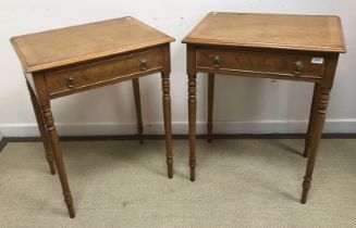 A pair of walnut lamp tables in the Regency style,