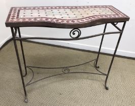 A 20th Century wrought iron framed tile top table of demi-lune form, 100 cm wide x 50.