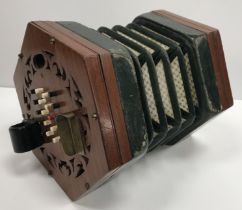 A 19th Century mahogany mounted concertina in the manner of Lachenal / Wheatstone, label missing,