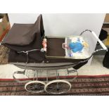 A Silver Cross coach built doll's pram in grey and burgundy with shopping tray, bag,