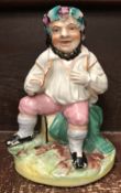 A 19th Century Staffordshire pottery figure of Bacchus seated upon a barrel, a beaker in his hand,