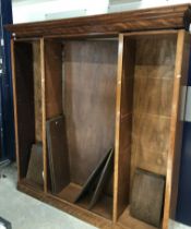 A mahogany open bookcase, the moulded cornice over three banks of adjustable shelving,