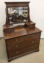 An Edwardian mahogany and satinwood strung dressing chest with mirrored superstructure over two