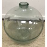 A glass carboy,