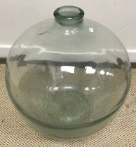 A glass carboy,