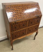 A 19th Century Maltese cube parquetry inlaid bureau with central star motif to each panel,