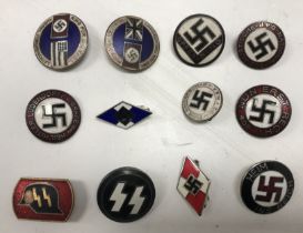 A collection of Third Reich NSDAP Nazi Party and SS pin/lapel badges,