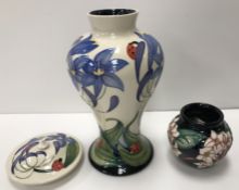 A modern Moorcroft "Fly Away Home" lidded vase decorated with flowers and ladybirds,