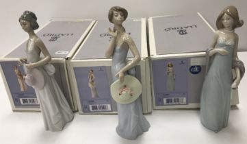 A collection of three boxed Lladro figures to comprising Summer Soiree,