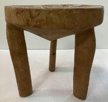 An Ashanti treen ware tripod stool,