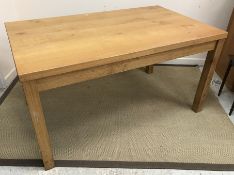 A modern oak rectangular kitchen table,