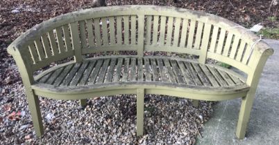 A slatted garden bench of bow back form, 150 cm long x approx.