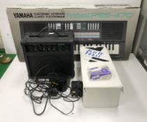 A Yamaha PSS-470 electronic keyboard (boxed),